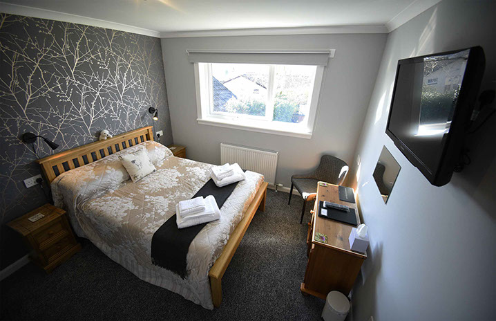 Our self catering apartment suite accommodation has a double bed with smart tv and WIFI internet